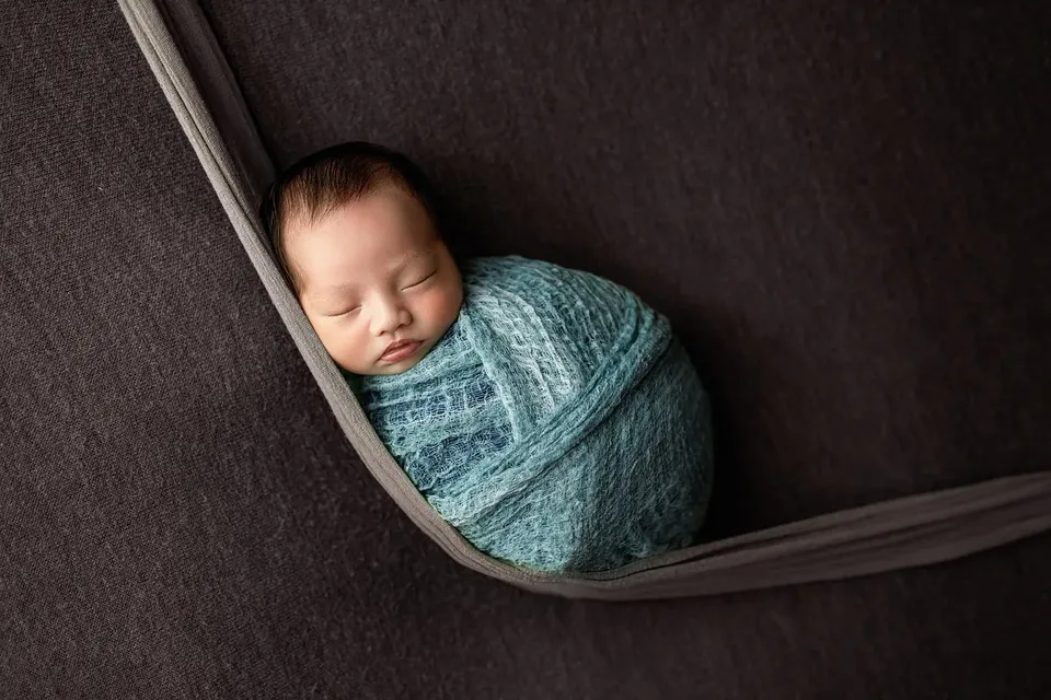 scottsdale newborn photographer baby boy simple pure white cream wrap fur